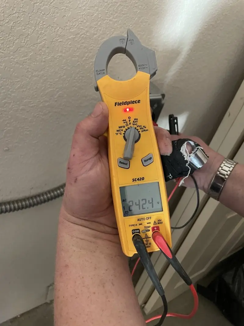 Voltage testing with clamp meter during Recessed Lighting Installation in Plymouth